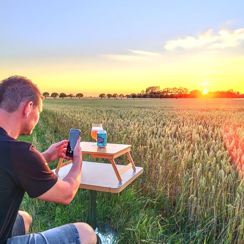 Photographing Svaneke Beer by a field in Skåne, Sweden | road trip | InTravel